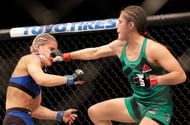 HOUSTON, TX - FEBRUARY 04:  Alexa Grasso (green) punches Felice Herrig (blue) in the Women's Strawweight Bout during UFC Fight Night at the Toyota Center on February 4, 2017 in Houston, Texas.  (Photo by Tim Warner/Getty Images)